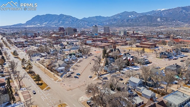 birds eye view of property featuring a view of city and a mountain view