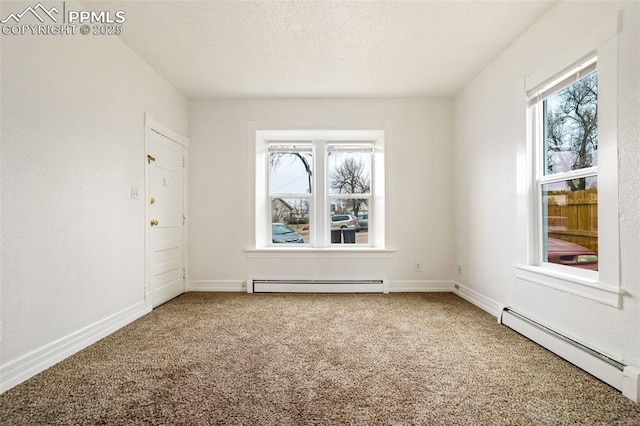 carpeted spare room featuring a textured ceiling, baseboard heating, and baseboards