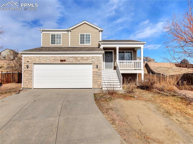 view of front of property featuring a garage and covered porch