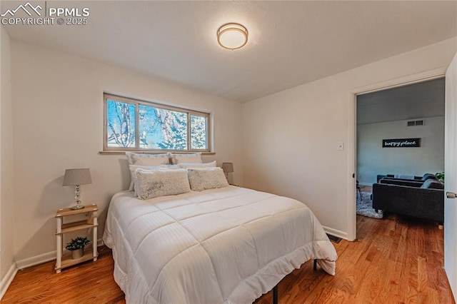 bedroom featuring light wood-type flooring