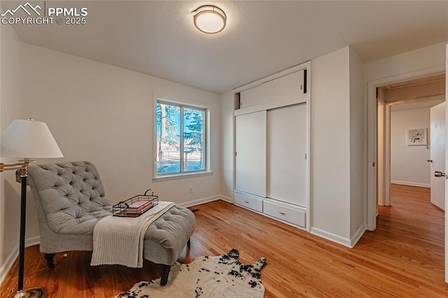 sitting room with light hardwood / wood-style floors