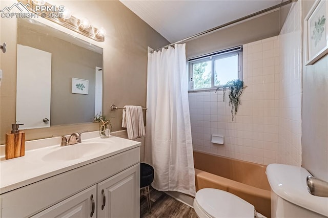 full bathroom featuring vanity, wood-type flooring, shower / bathtub combination with curtain, and toilet