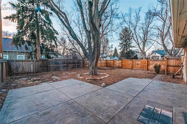 view of patio terrace at dusk