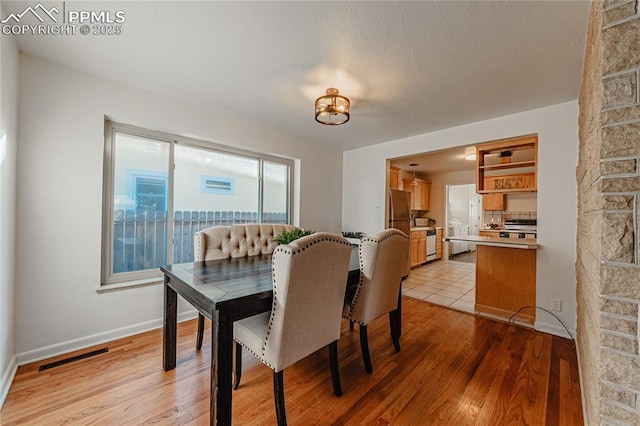 dining area featuring light hardwood / wood-style floors