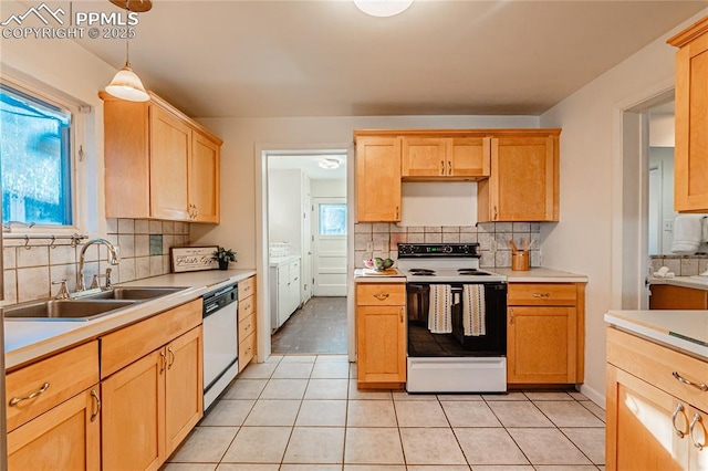 kitchen with pendant lighting, sink, dishwasher, backsplash, and white electric stove