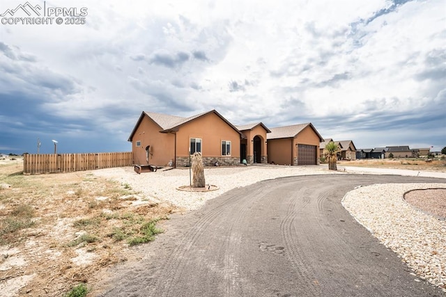 single story home with a garage