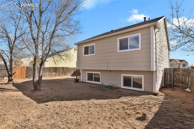 back of property with a fenced backyard