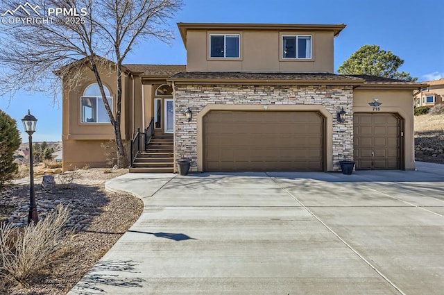 view of front of property with stone siding, driveway, and stucco siding