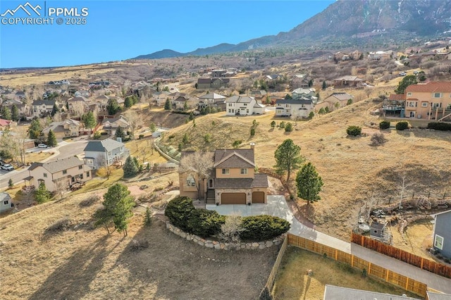 bird's eye view with a residential view and a mountain view