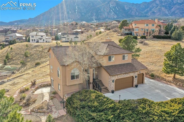 aerial view with a residential view and a mountain view