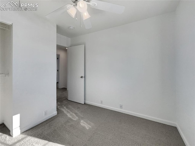 spare room with ceiling fan and light colored carpet