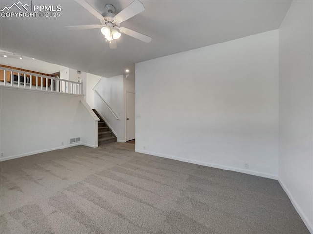 unfurnished living room with light carpet and ceiling fan