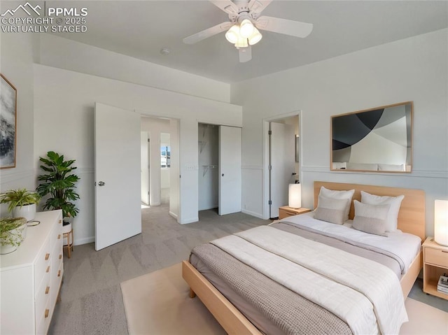 carpeted bedroom featuring ceiling fan and a closet