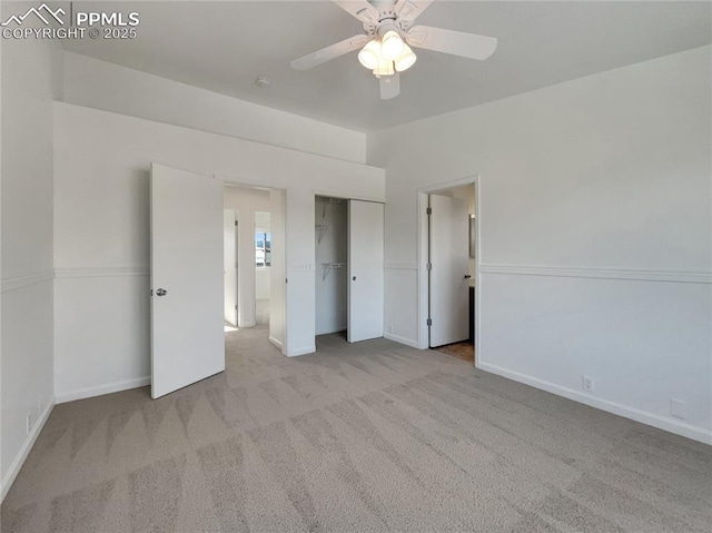 unfurnished bedroom featuring light colored carpet and ceiling fan