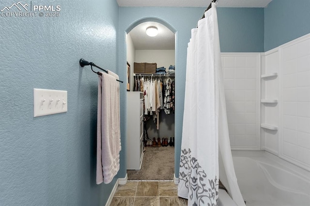 bathroom with shower / bath combination with curtain