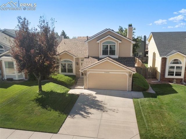 view of front of house with a garage and a front lawn