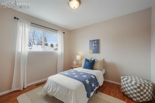 bedroom with hardwood / wood-style floors