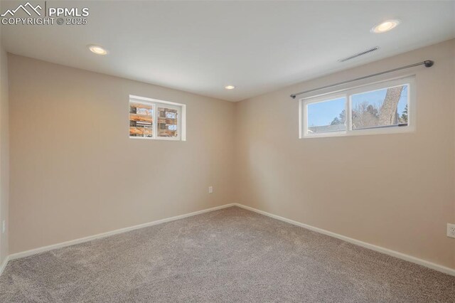 unfurnished room featuring carpet