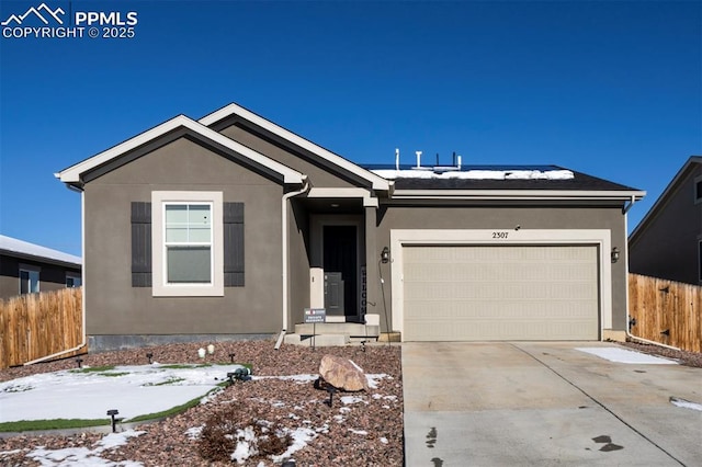 ranch-style house featuring a garage