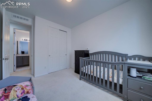 carpeted bedroom with a closet