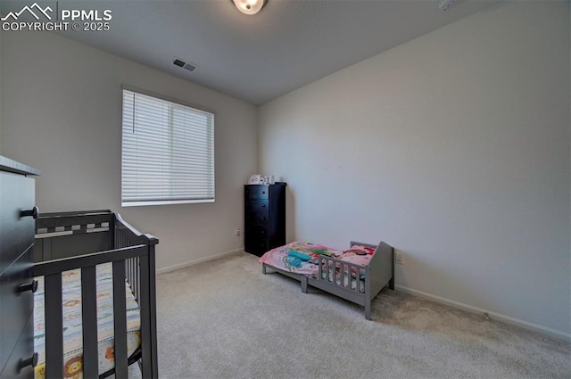 bedroom with light carpet