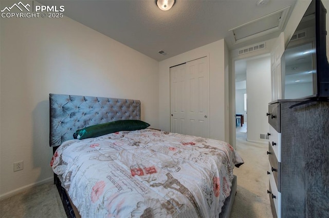 carpeted bedroom with a closet