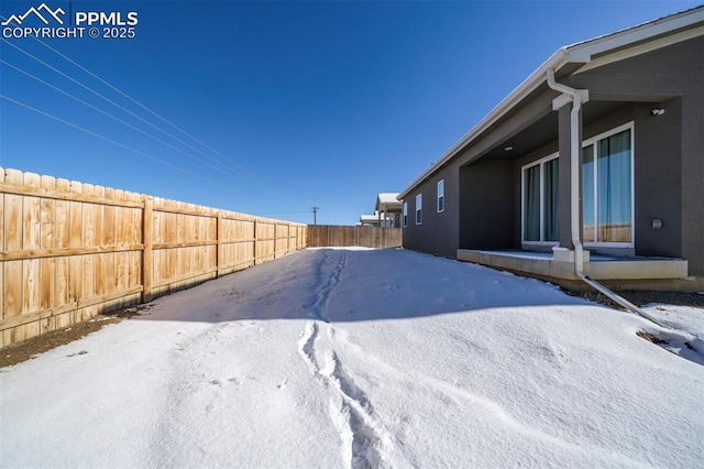 view of yard covered in snow