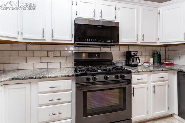 kitchen with tasteful backsplash, appliances with stainless steel finishes, and white cabinets