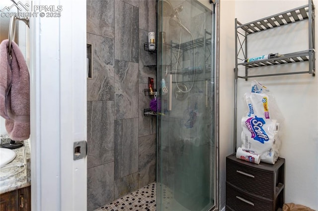 full bathroom with a stall shower and vanity