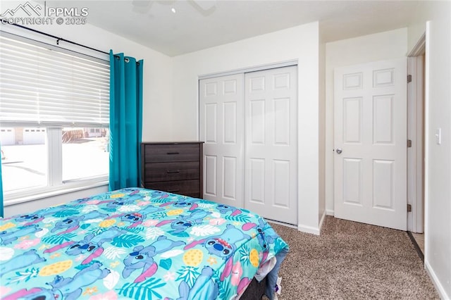 bedroom featuring ceiling fan, a closet, carpet flooring, and baseboards