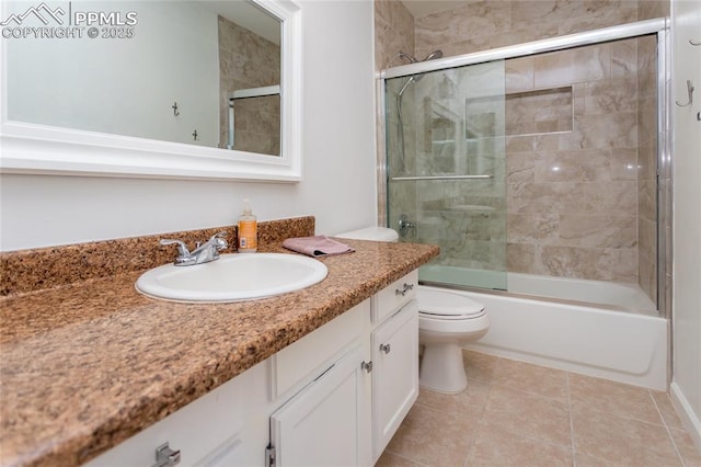 full bath with toilet, tile patterned floors, enclosed tub / shower combo, and vanity