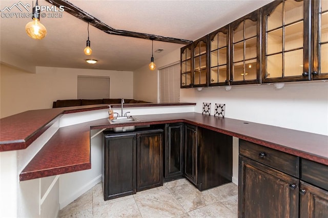 bar with pendant lighting and a sink