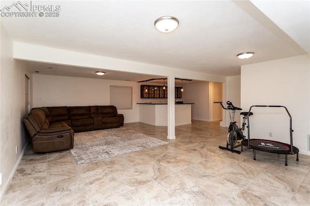 workout room featuring baseboards