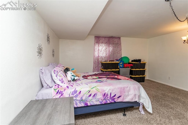 bedroom featuring carpet floors and baseboards