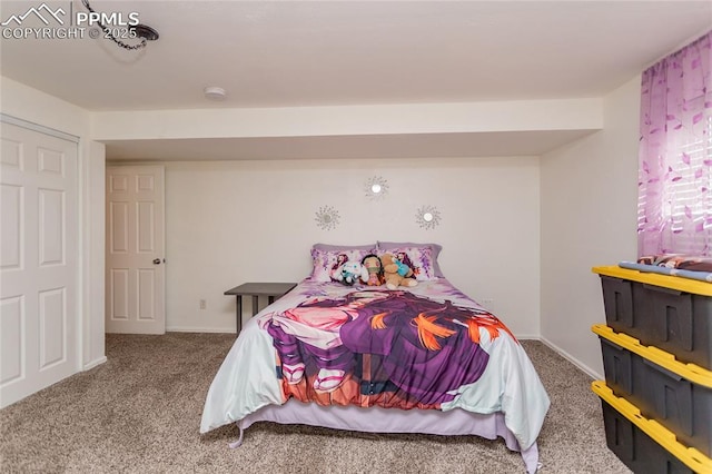 carpeted bedroom featuring baseboards