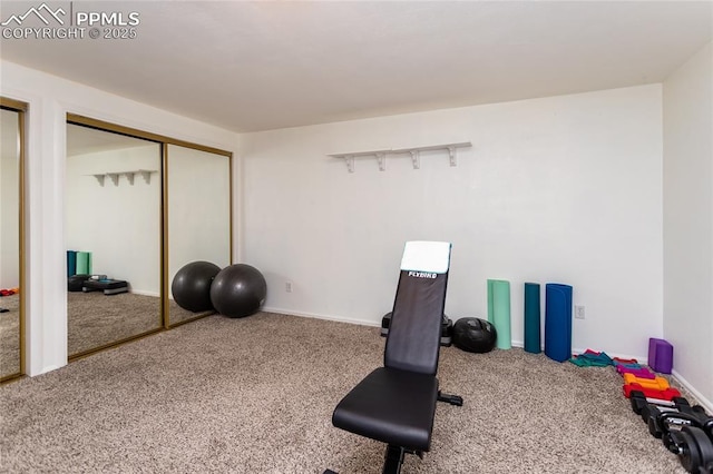 workout room with carpet and baseboards