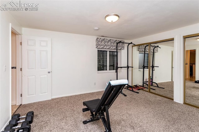 workout room with carpet flooring and baseboards