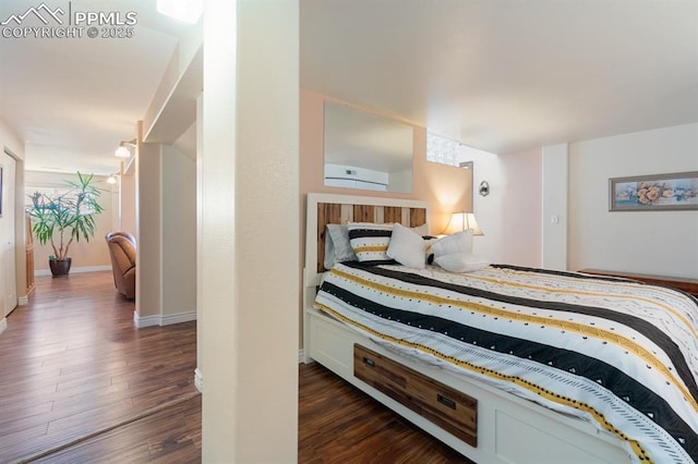 bedroom featuring dark hardwood / wood-style flooring