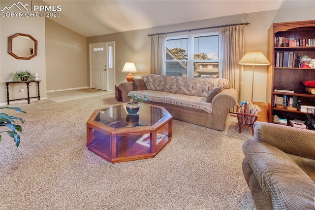 carpeted living room with lofted ceiling