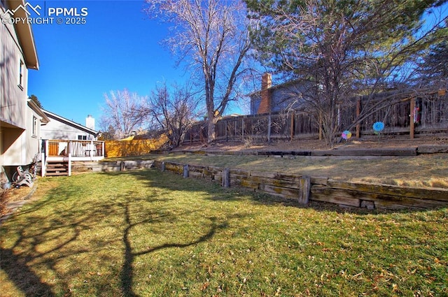 view of yard featuring a wooden deck