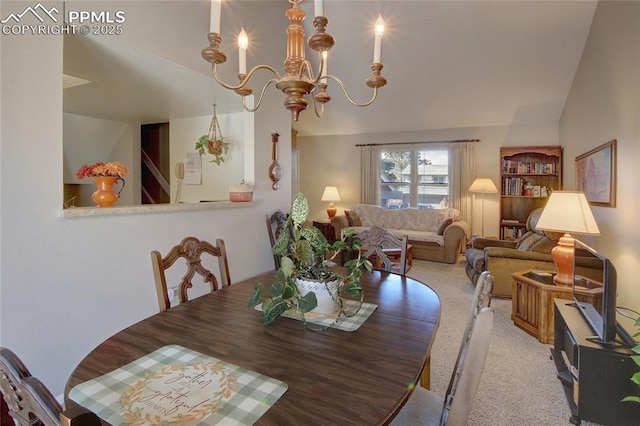 dining area with light colored carpet, lofted ceiling, and a chandelier