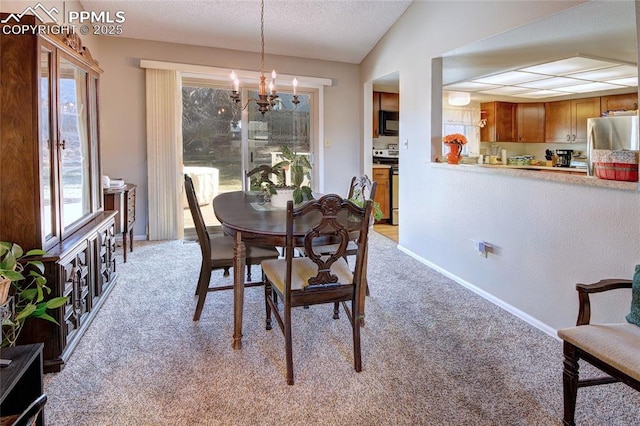 carpeted dining area featuring lofted ceiling, a notable chandelier, and a textured ceiling