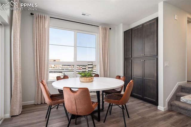 dining area featuring dark hardwood / wood-style flooring