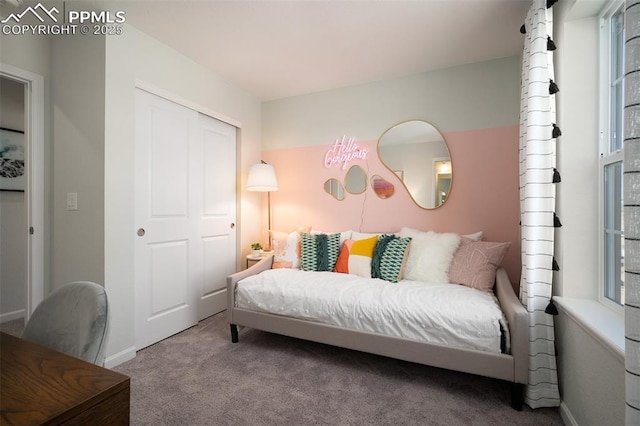 carpeted bedroom featuring a closet