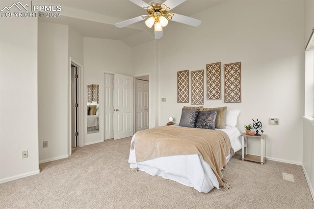 bedroom with high vaulted ceiling, light colored carpet, and ceiling fan