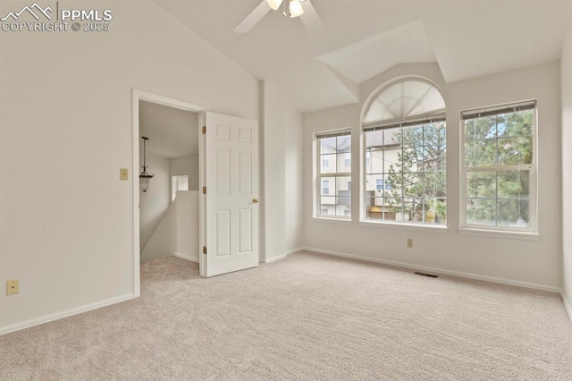 interior space with lofted ceiling and ceiling fan