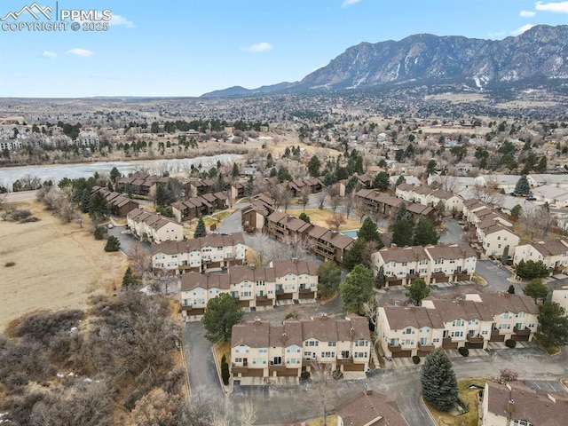 drone / aerial view featuring a mountain view