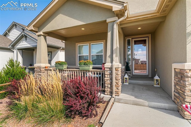 view of exterior entry featuring a porch