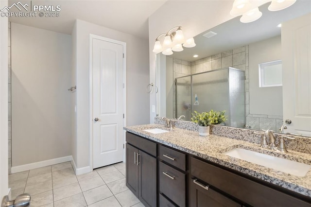 bathroom with vanity, an enclosed shower, and tile patterned floors