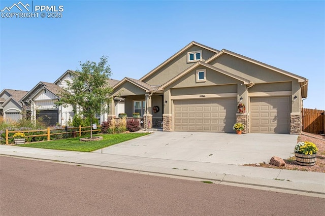 craftsman house featuring a garage and a front yard